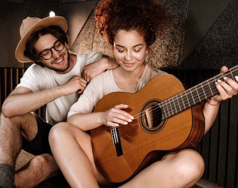 young-stylish-musicians-happily-composing-new-song-QAX4JZ6